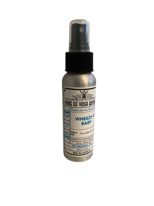 Temp Pic: photo of room spray aluminum bottle with black plastic spray cap, Wheezy F. Baby label. 